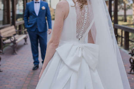 a groom and bride in autumn in the parkの写真素材