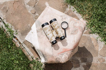 a binoculars lying on the grass