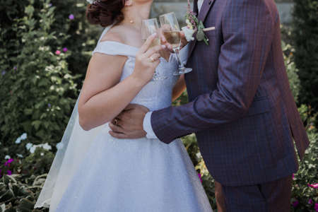 bride and groom in park together at the weddingの写真素材