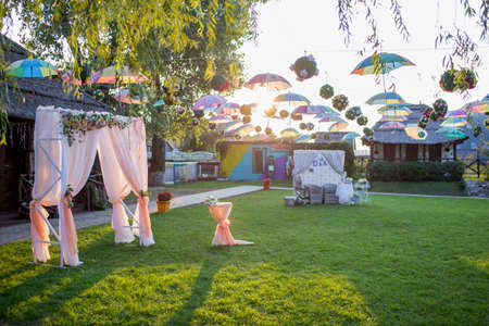 arch for a wedding ceremony in green meadowの写真素材
