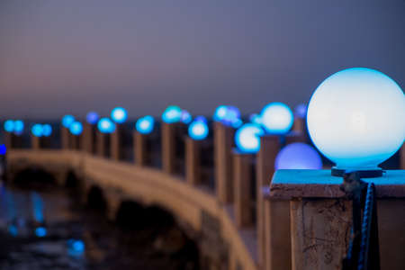 a lanterns on the pier in the sea