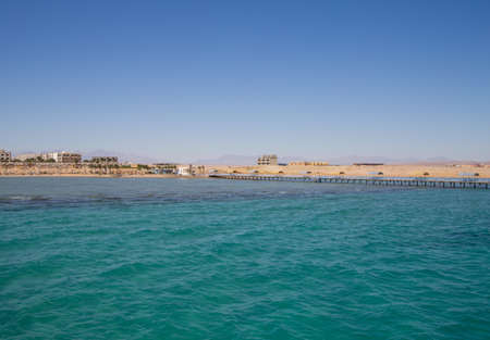 a sea beach with palms and houses in egypt