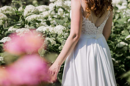 a bride in a wedding dress in flowers