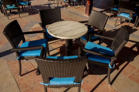 an outdoor restaurant tables and chairs