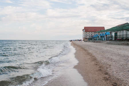 a sea beach with clear water and skyの写真素材