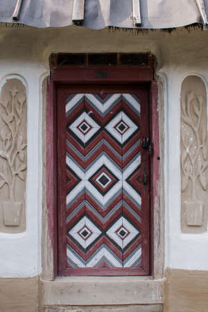 an old wooden door with patternsの写真素材