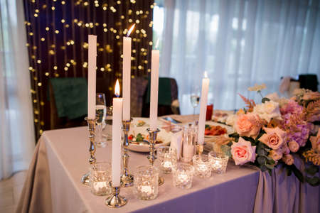 a candles and decor on the wedding tableの写真素材