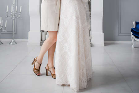 bride in wedding dress with bridesmaid weddingの写真素材