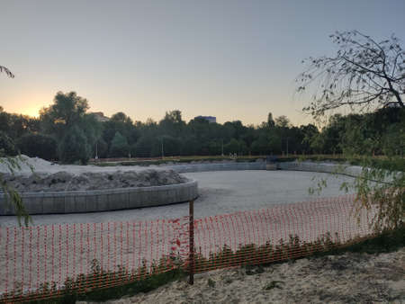 a construction site on the riverbed in the park