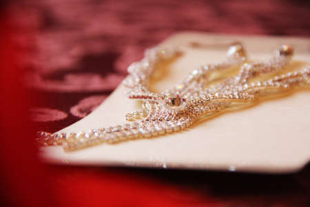 a beautiful gold wedding rings on the pillowの写真素材