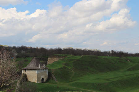 an old stone castle in a green field