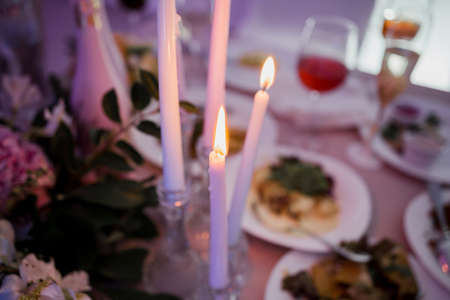 candles in the evening on the table in restaurantの写真素材