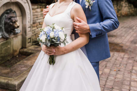 groom with bride together in autumn park wedding