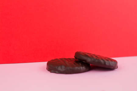 a chocolate chip cookies on pink backgroundの写真素材