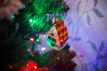 a beautiful toys on the christmas tree with garlandの写真素材