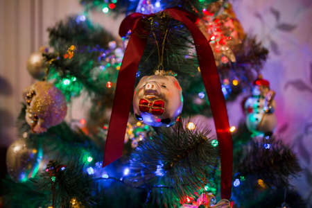 a beautiful toys on the christmas tree with garlandの写真素材