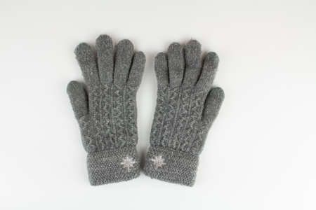 a women's winter knitted mittens on a white background