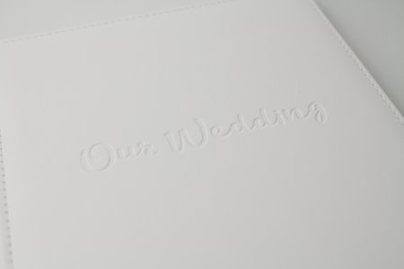 a white wedding photo book from white leather on white backgroundの写真素材