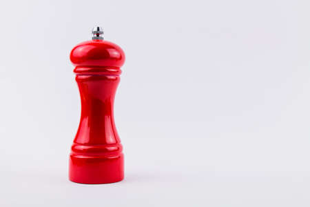 a red pepper shaker on white backgroundの写真素材