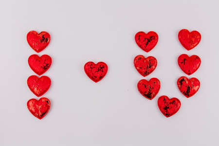 a inscription from red hearts I love you on a white background holiday of love of valentine's day on february 14の写真素材