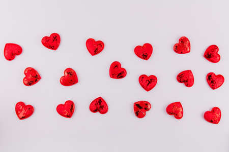 a background of red hearts on a white background for the feast of lovers Valentine's day February 14