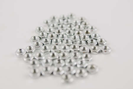 a many new nuts for repair on a white background