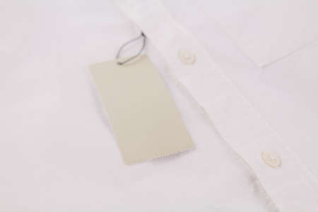 a blank tag for price on white shirt