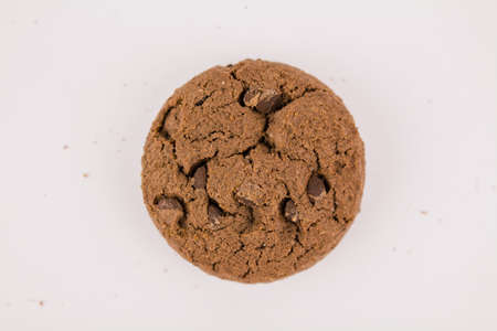 a chocolate chip cookies with chocolate pieces on white backgroundの写真素材