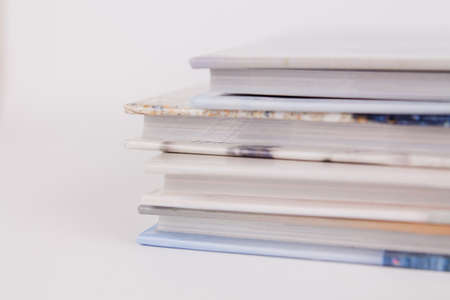 a books are in a pile on top of each other on a white backgroundの写真素材