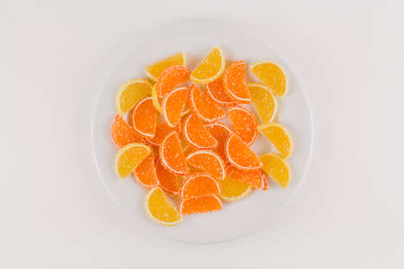 a marmalade in the form of slices of orange and lemon in sugar