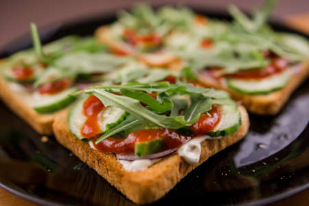 a delicious rocket salad sandwiches on a plate