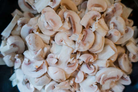 lot of champignon mushrooms on the tableの写真素材