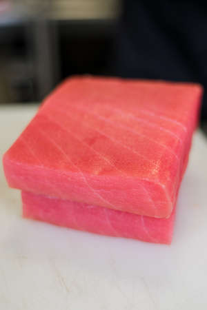 large piece of tuna fillet on the tableの写真素材