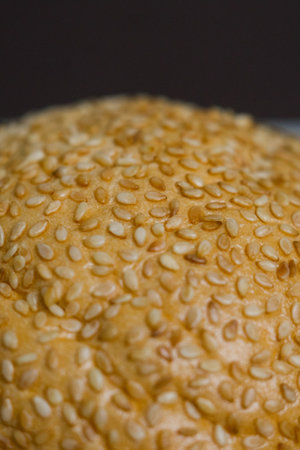 a fried sesame seeds on a bun close upの写真素材