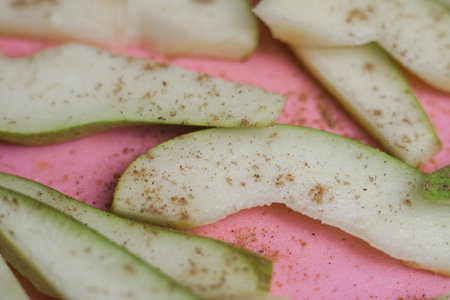 a chopped ripe pear on the kitchen tableの写真素材