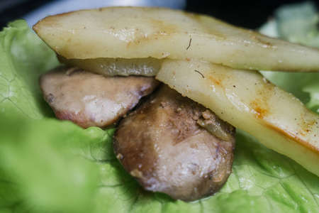 a pear with chicken liver in a salad in the kitchenの写真素材