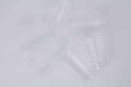 a transparent plastic glasses on white background ecologyの写真素材