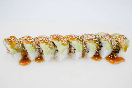 a Japanese cuisine roll with avocado and sesame seedsの写真素材