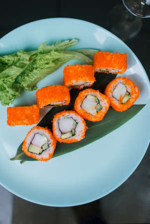 a Japanese roll with tuna and white rice in tobiko caviarの写真素材