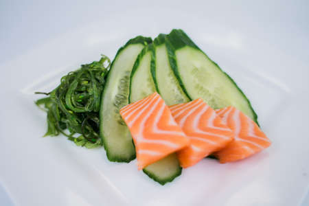a salmon with cucumber and algae japanese cuisine in the restaurant deliveryの写真素材