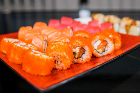 set of sushi rolls from fish and seafood a set of different videos japanese cuisine deliveryの写真素材