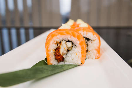 a sushi roll philadelphia with salmon on a plate japanese cuisineの写真素材