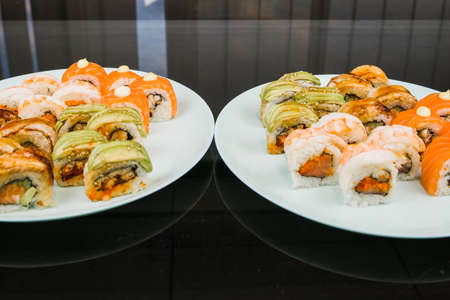 a set of rolls set sushi with avocado shrimp salmon and eelの写真素材