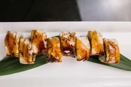 sushi roll with eel and unagi sauce on a plate japanese cuisineの写真素材