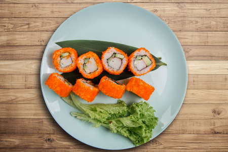 a Japanese roll with tuna and white rice in tobiko caviarの写真素材