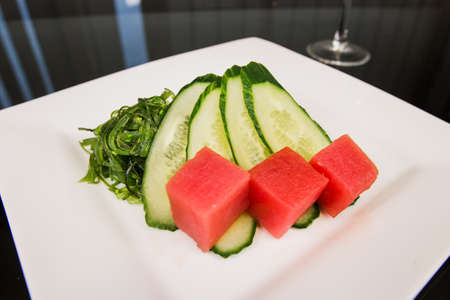 a tune with cucumber and algae japanese cuisine in the restaurant deliveryの写真素材