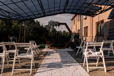 a beautiful arch for the wedding ceremony on the pierの写真素材