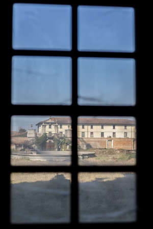 an old window with wooden frame in an old European architecture house