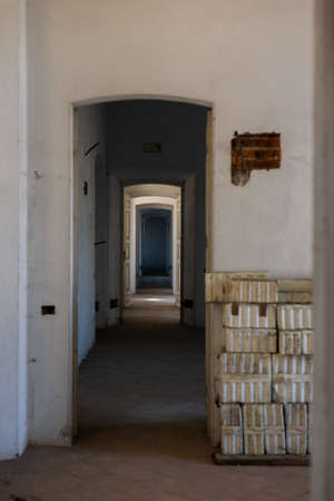 a long corridor with arches in an old house in europeの写真素材