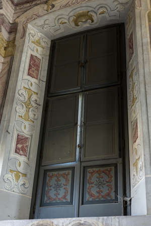 a beautiful vintage wooden door in an old antique villaの写真素材
